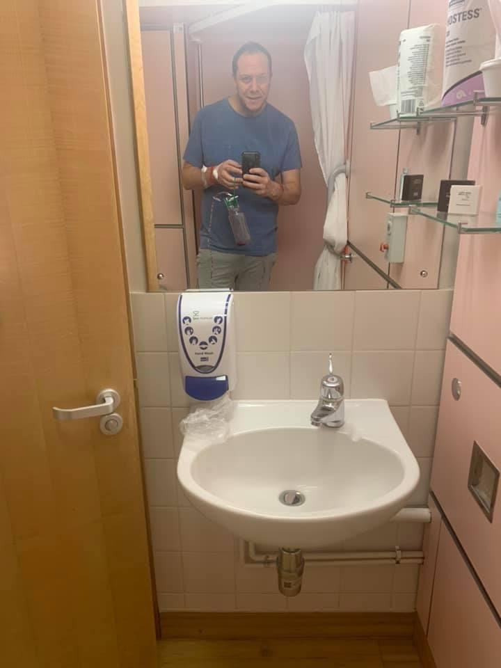 I'm up, and I don't have a catheter in. I can pee again! In a bathroom at St Anthony's Hospital, Surrey, England