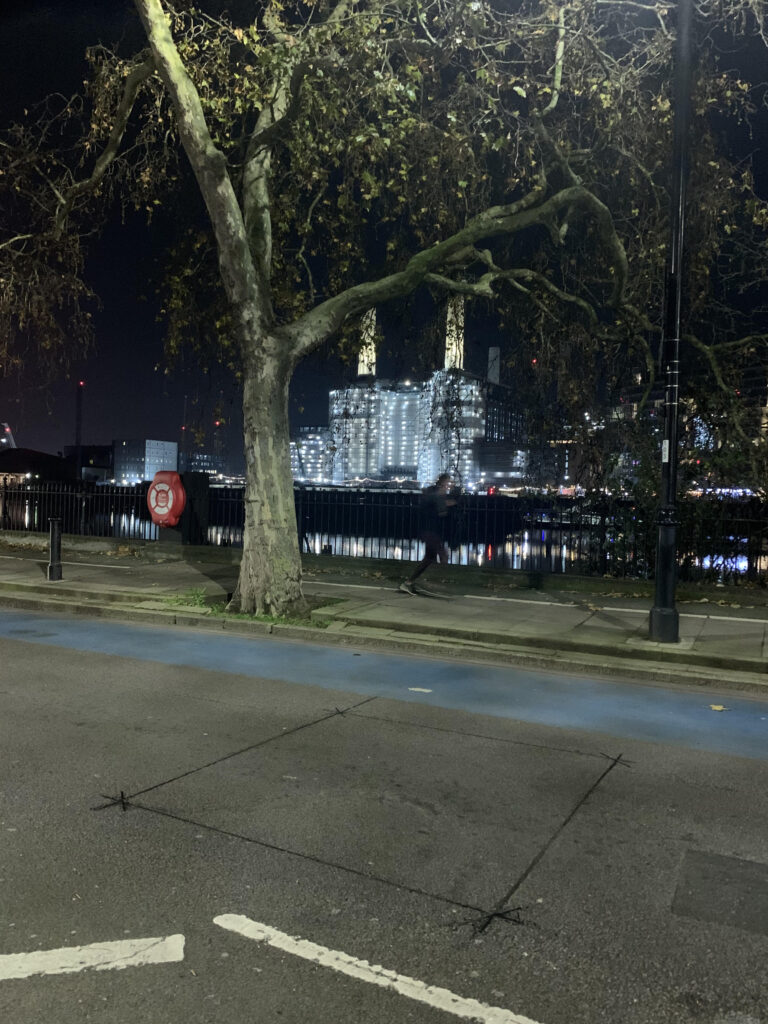 A picture of London at night showing the journey Battersea power station, London at night. Taken from the north bank of the Thames