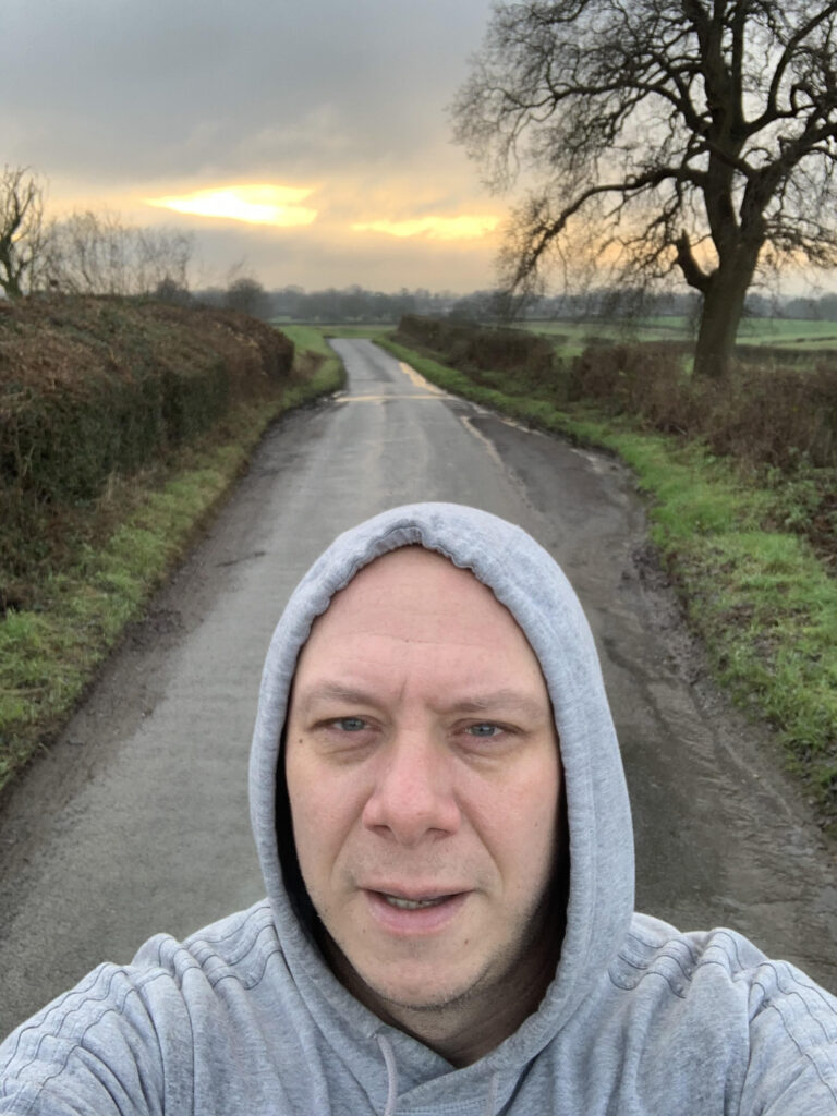 Me, struggling at first light.  Pest House Lane, Hertfordshire.